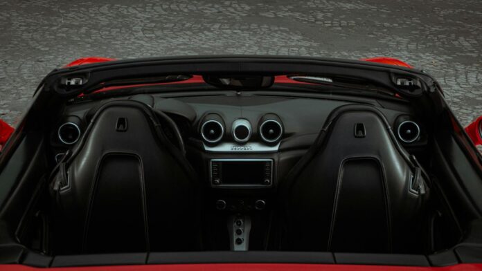 the interior of a red sports car